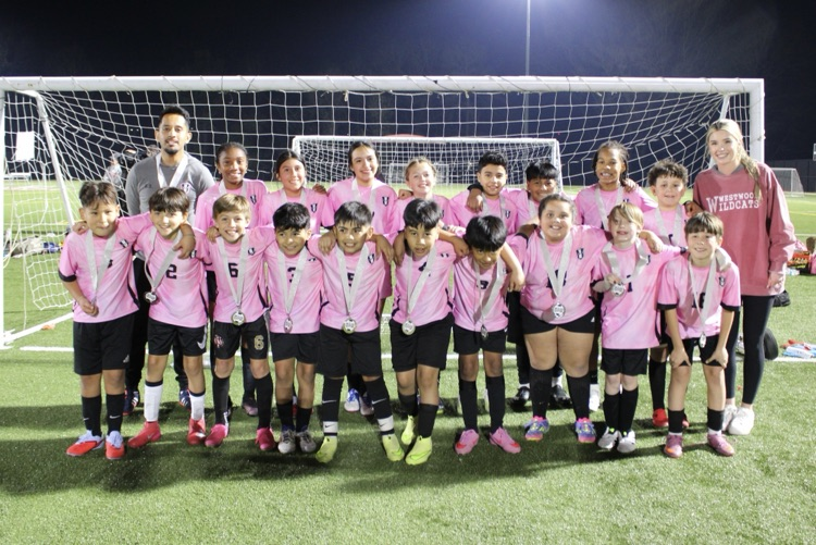 A team picture with their medals 