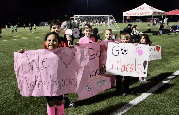 Students cheering on their soccer team 