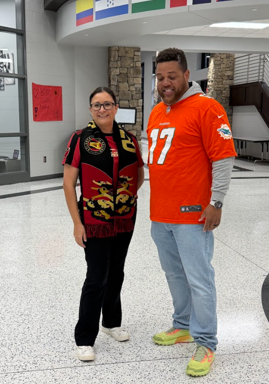 picture of fabiola and terrence wearing their favorite sports teams