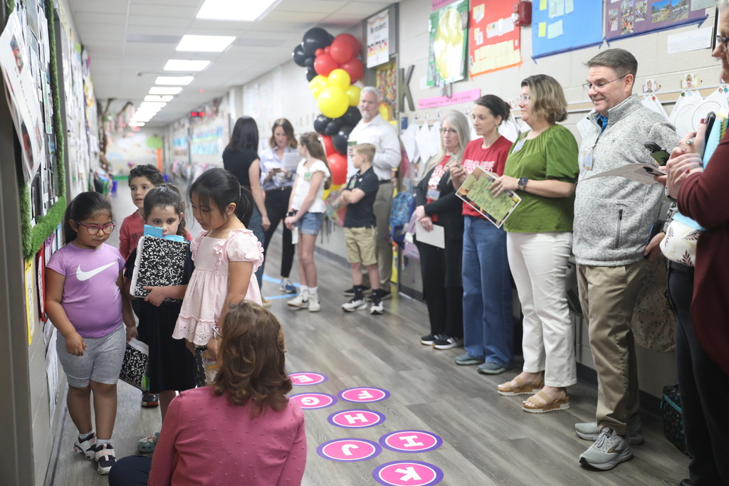 Students presenting to a crowd of educators.