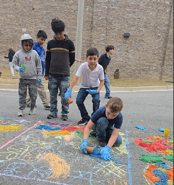 Students working on the alfombras 