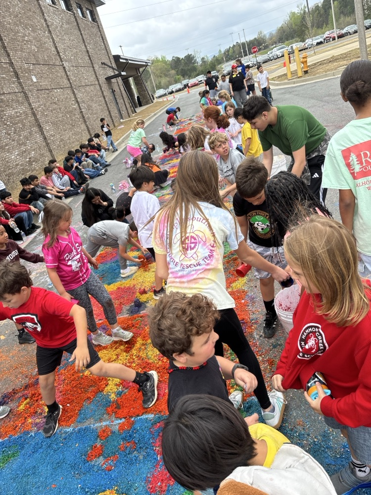 Westwood students and Hammond Creek students working on the alfombras 