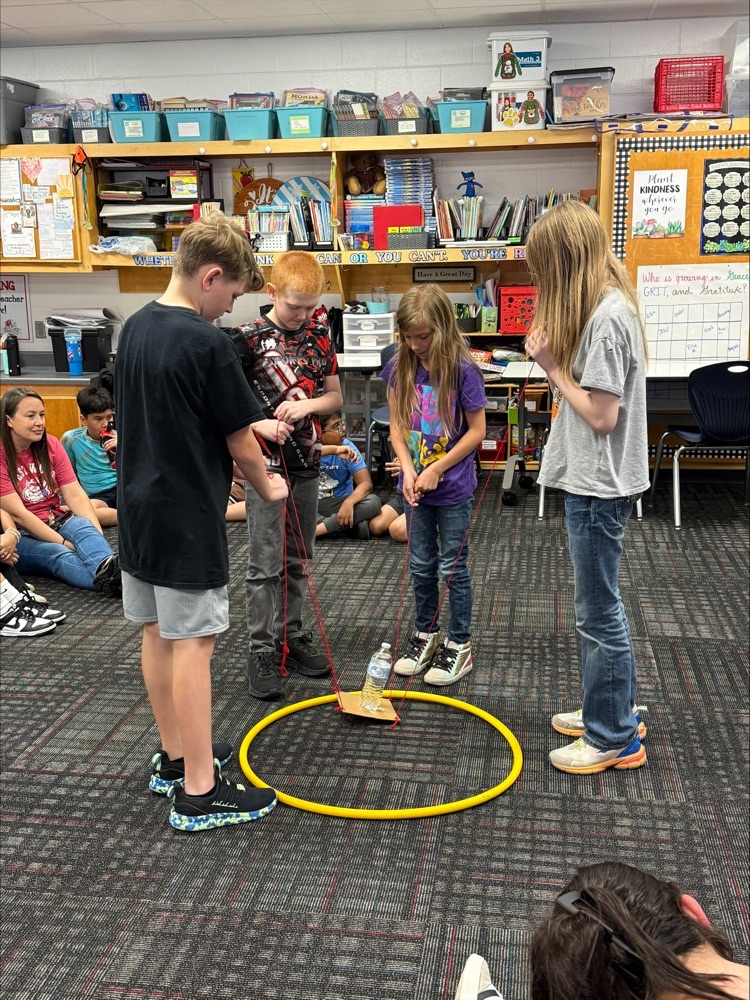 A group of students working together to achieve a task 