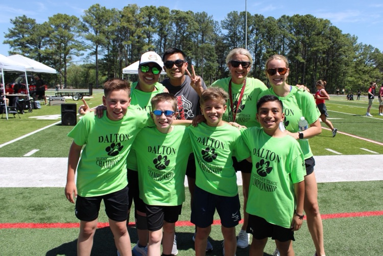 Fourth grade boys on the field with Mrs. King