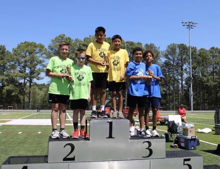 Fourth grade boys on the podium getting 2nd place