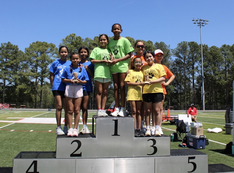 Third grade girls on the podium getting 1st place