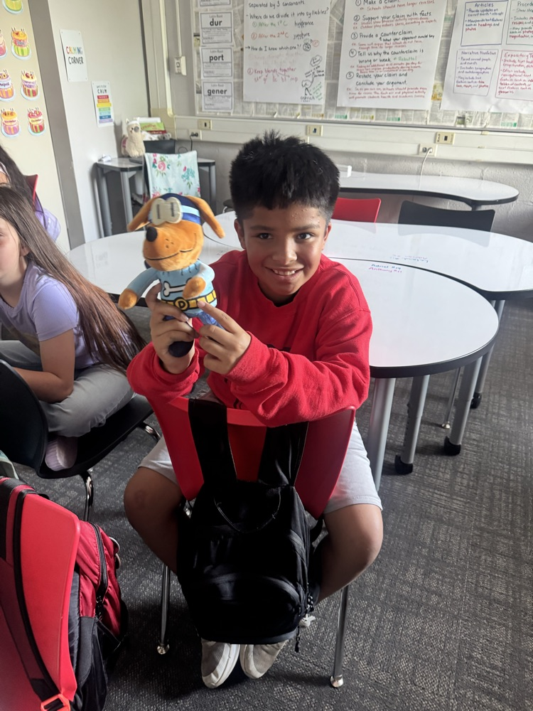 student in classroom watching livestream 