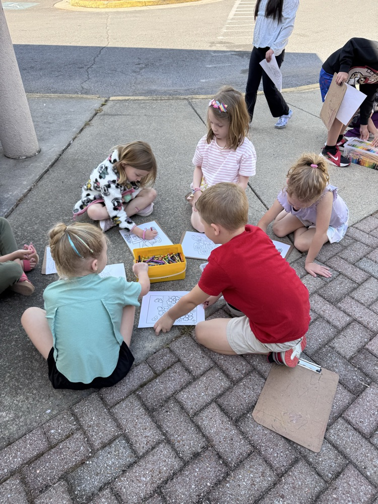 Students coloring outside 