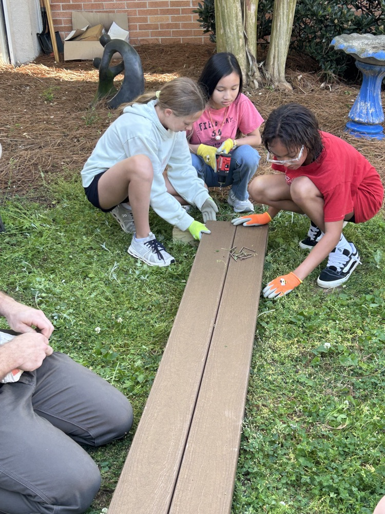 Students helping building the flower beds 