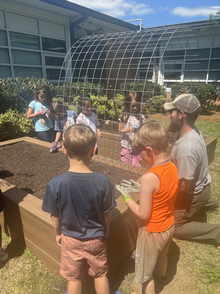Students working on the flower beds 
