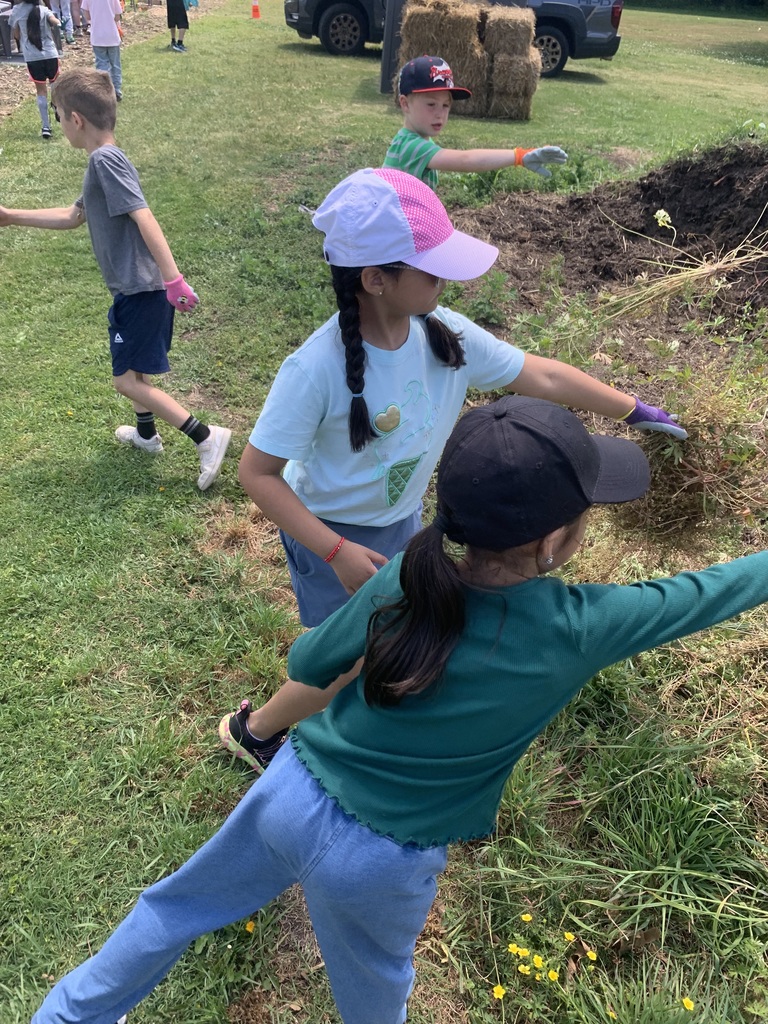 students cleaning out garden beds