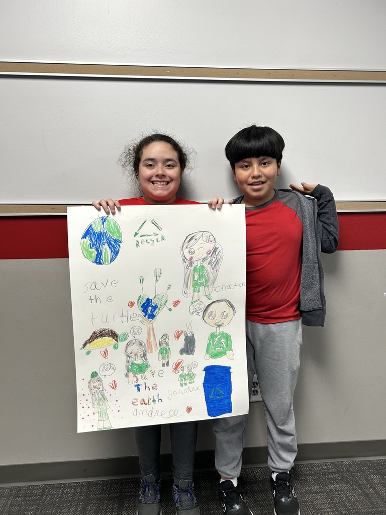 4th Grade students with pollution posters