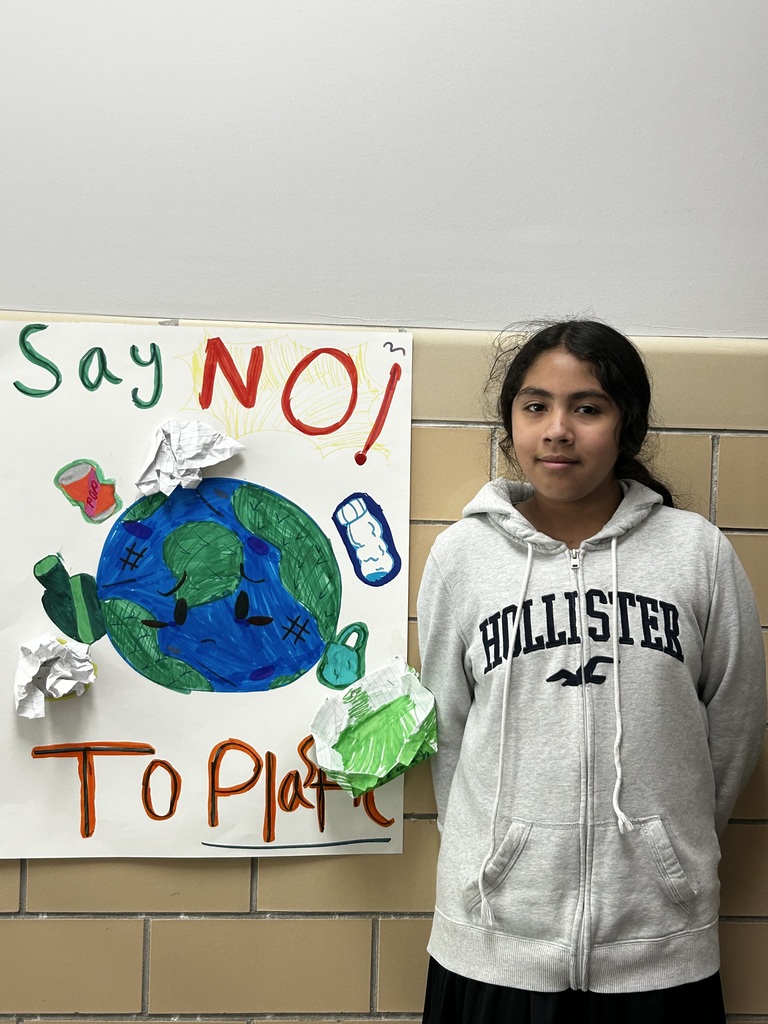 4th Grade students with pollution posters