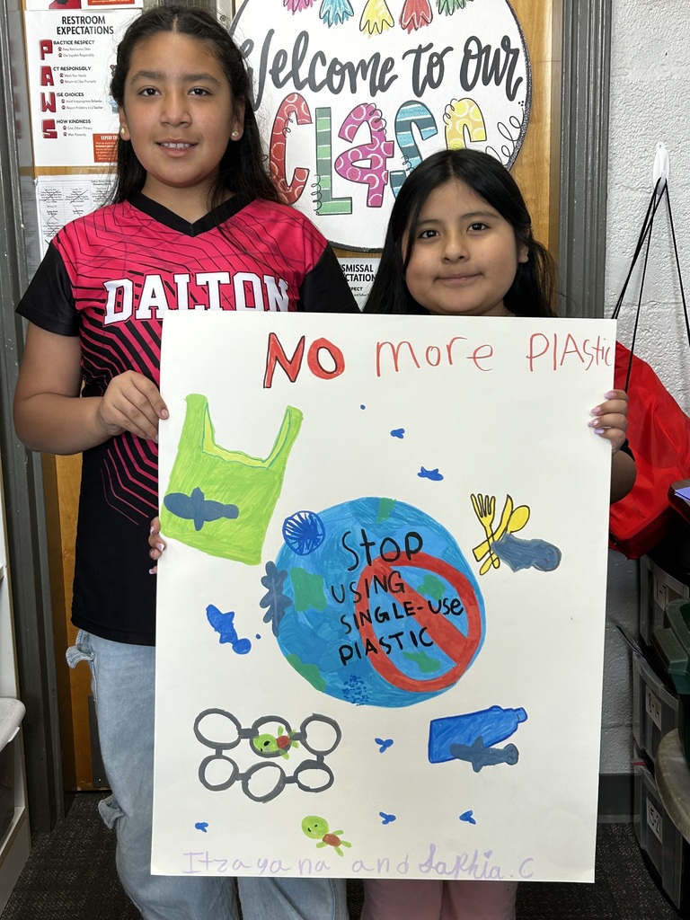 4th Grade students with pollution posters