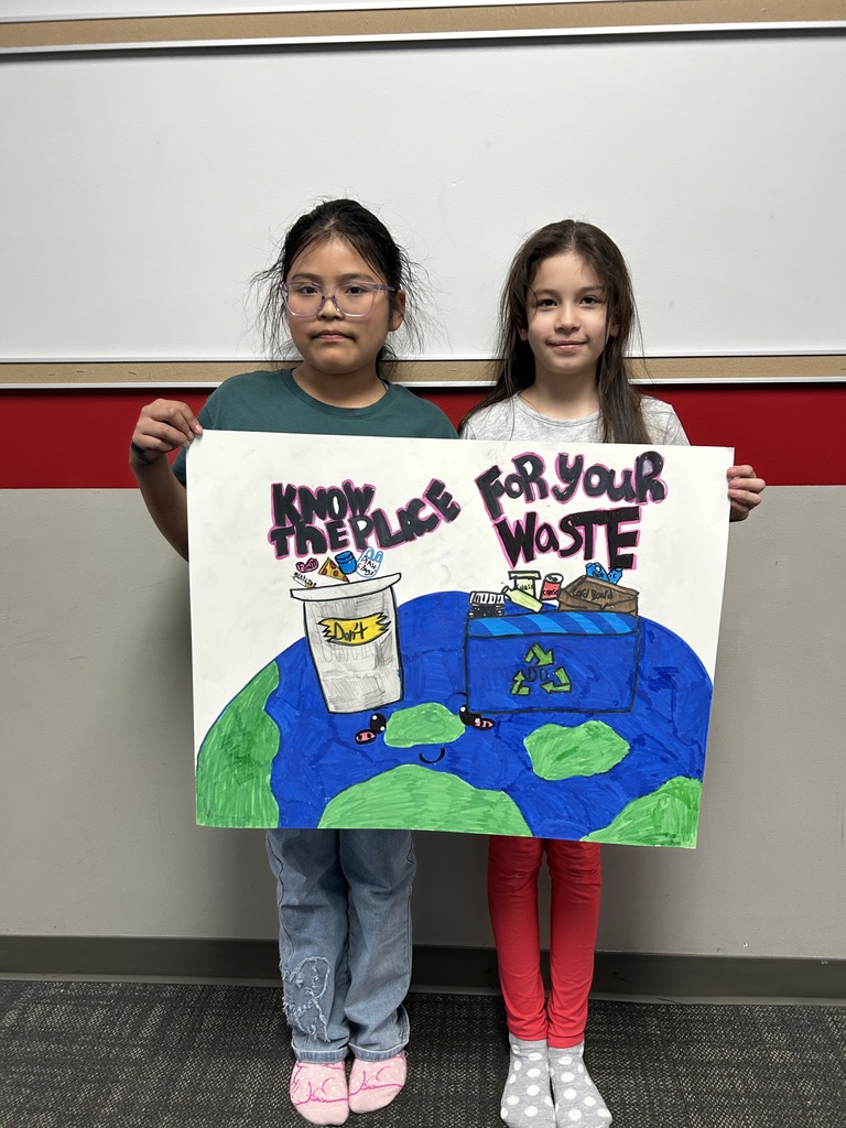 4th Grade students with pollution posters