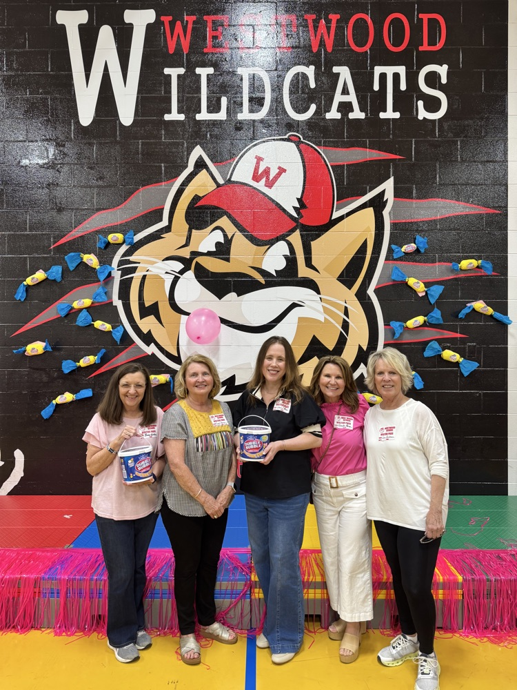 A picture of the Family Council representative holding bubble gum tub on the front stage 