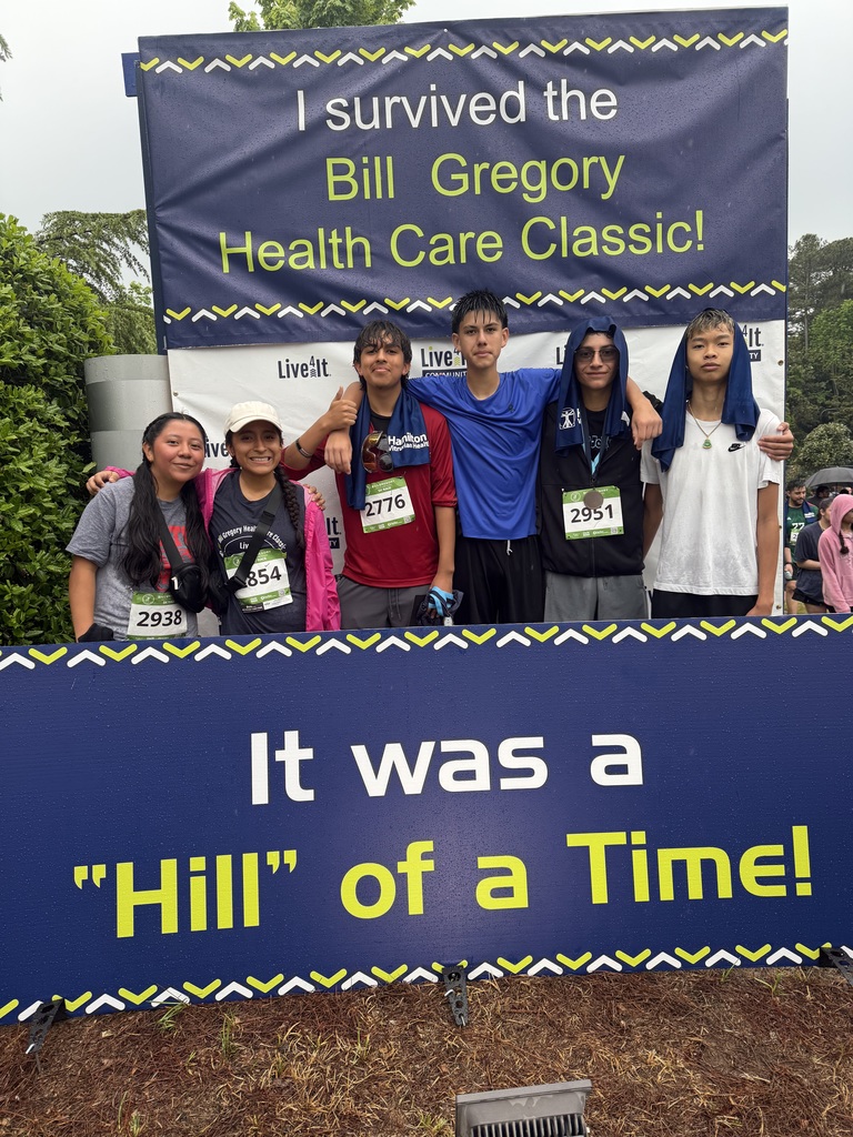 DJHS students participating in the Bill Gregory Health Care Classic. Sign says "I survived the Bill Gregory Health Care Classic! It was a Hill of a Time!"