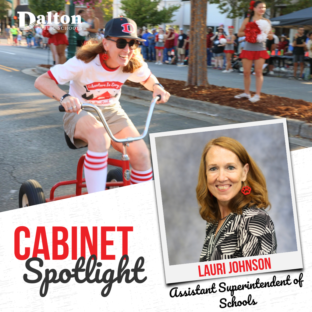 A “Cabinet Spotlight” graphic from Dalton Public Schools featuring Lauri Johnson, Assistant Superintendent of Schools. The design includes an action photo of her riding a red tricycle during a parade while smiling and wearing Dalton-themed attire, alongside a professional portrait framed like a Polaroid. The Dalton Public Schools logo appears in the top left corner, with bold red and black text highlighting her name and title.