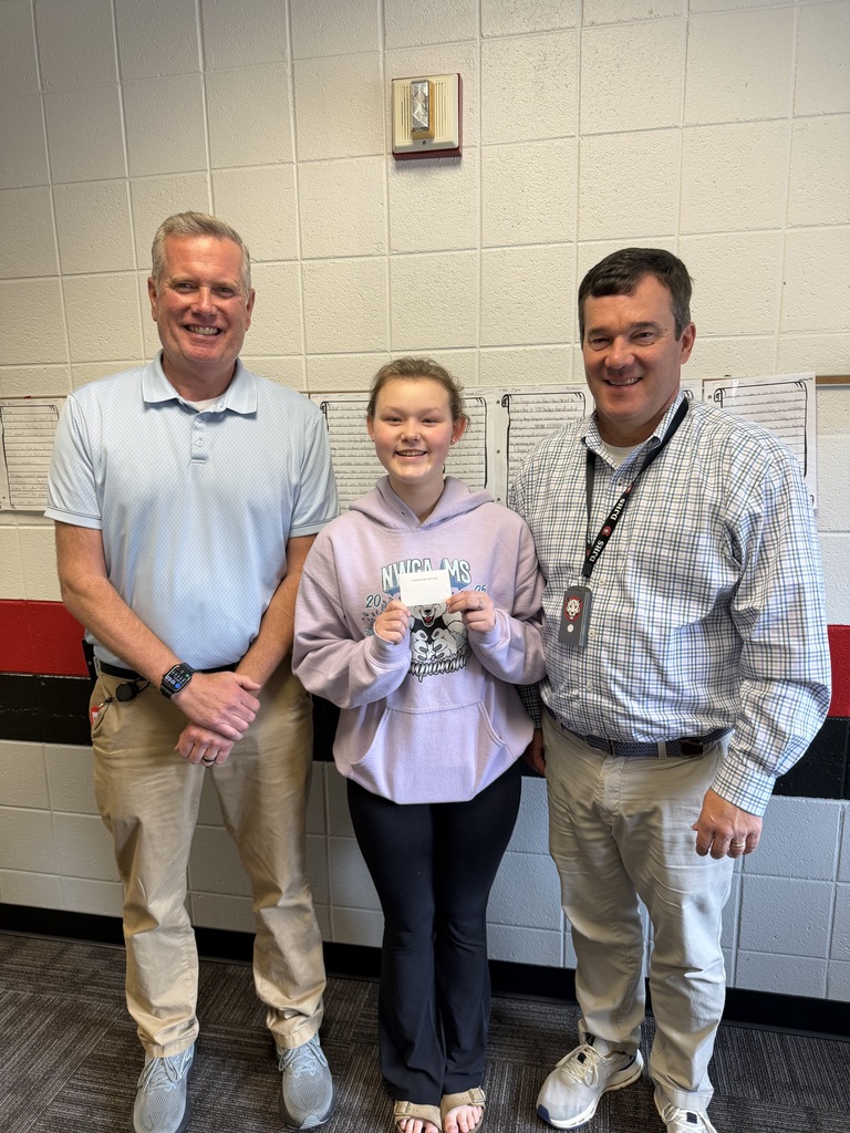AP and Principal presenting an award to student