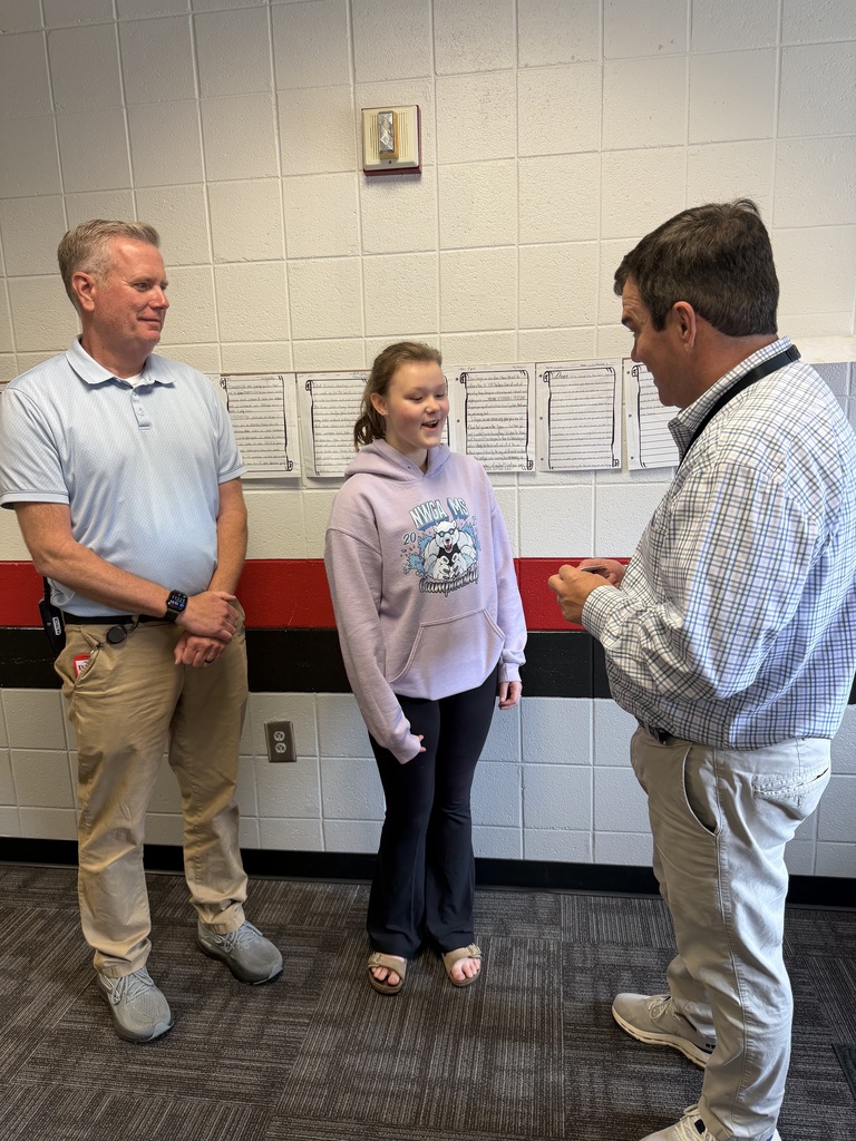 AP and Principal presenting an award to student