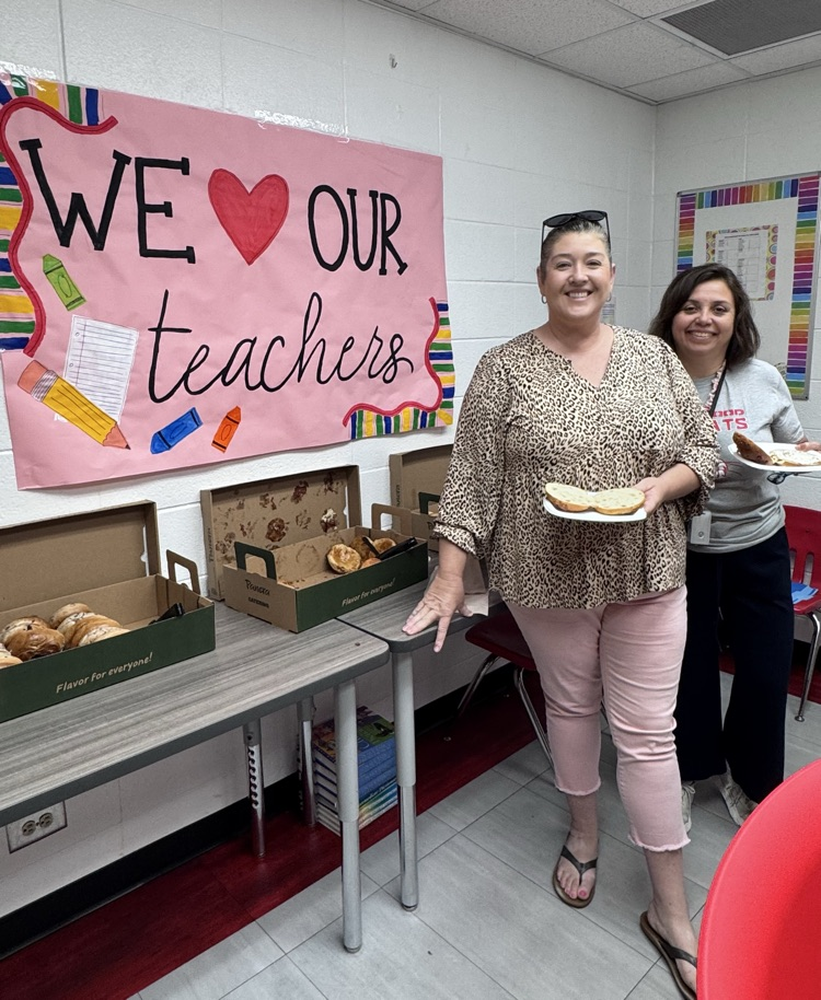 Two teachers getting their bagels for breakfast 