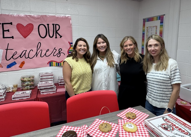 A picture of four PTO moms helping during lunch time 