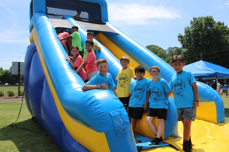 Fourth graders in line to climb an inflatable 