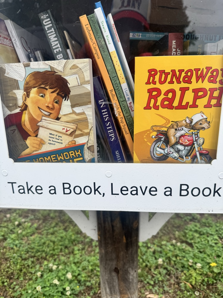 pawz filling little free libraries with books