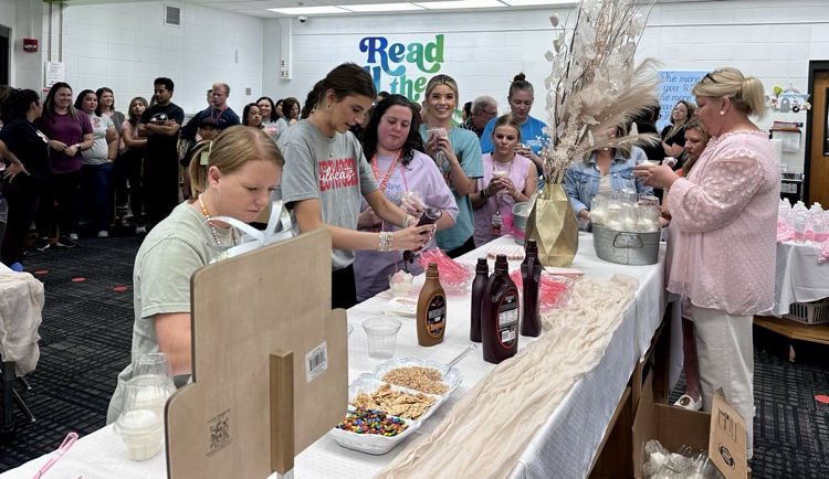 Staff going through the line to get their ice cream sundae