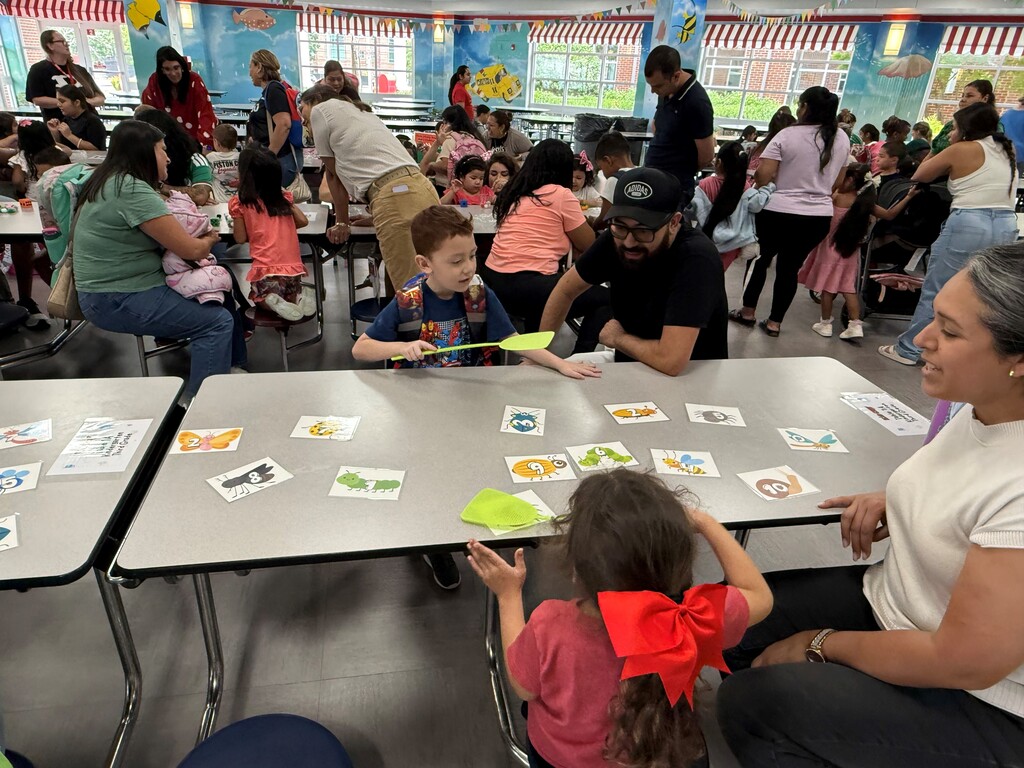 On Tuesday, June 16, the Rising Pre-K and Kindergarten Summer Transition Program hosted its first annual Magical Math Family Workshop, inviting students and families to explore the joy of numeracy through hands-on learning stations.  This year’s theme, “A Bug’s Life,” brought together the excitement of math and science as students worked through six engaging stations that combined counting, problem-solving, and insect-themed fun! From plastic spiders and web mats to fly swatters and dice games, every activity was designed to spark curiosity and build foundational math skills in a playful, memorable way.  Families rotated through stations including:  Roll, Find, and Stamp – practicing number recognition and fine motor skills Race to Fill – counting and comparing using dice, cups, and pom-poms How Many Bugs Am I Hiding? – building estimation and early addition skills Subitizing Cups – recognizing quantities quickly using dot stickers and patterns Smack the Bug Counting Game – developing number fluency with a fun twist Collecting Bugs – exploring preschool-level addition with bugs and butterflies It was a fantastic afternoon of math, movement, and memory-making for our young learners and their families