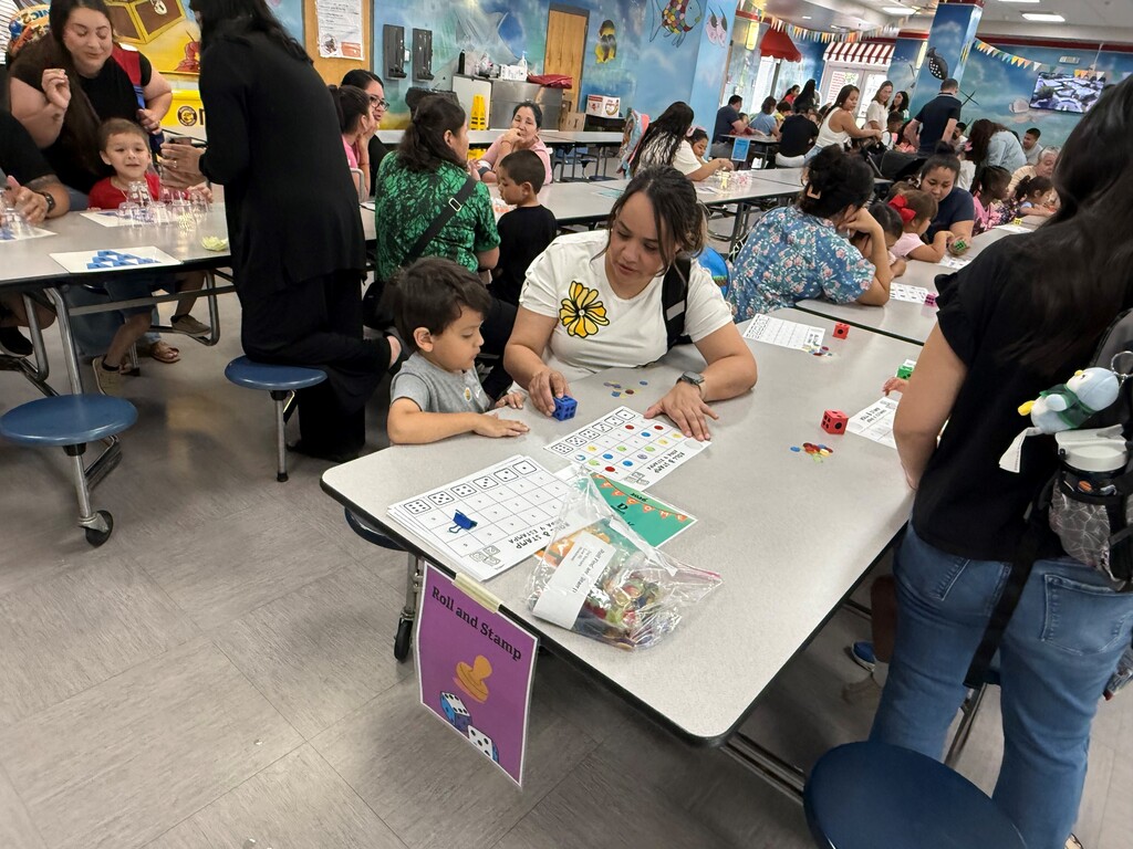 On Tuesday, June 16, the Rising Pre-K and Kindergarten Summer Transition Program hosted its first annual Magical Math Family Workshop, inviting students and families to explore the joy of numeracy through hands-on learning stations.  This year’s theme, “A Bug’s Life,” brought together the excitement of math and science as students worked through six engaging stations that combined counting, problem-solving, and insect-themed fun! From plastic spiders and web mats to fly swatters and dice games, every activity was designed to spark curiosity and build foundational math skills in a playful, memorable way.  Families rotated through stations including:  Roll, Find, and Stamp – practicing number recognition and fine motor skills Race to Fill – counting and comparing using dice, cups, and pom-poms How Many Bugs Am I Hiding? – building estimation and early addition skills Subitizing Cups – recognizing quantities quickly using dot stickers and patterns Smack the Bug Counting Game – developing number fluency with a fun twist Collecting Bugs – exploring preschool-level addition with bugs and butterflies It was a fantastic afternoon of math, movement, and memory-making for our young learners and their families