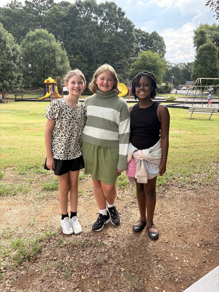 students smiling on the playground