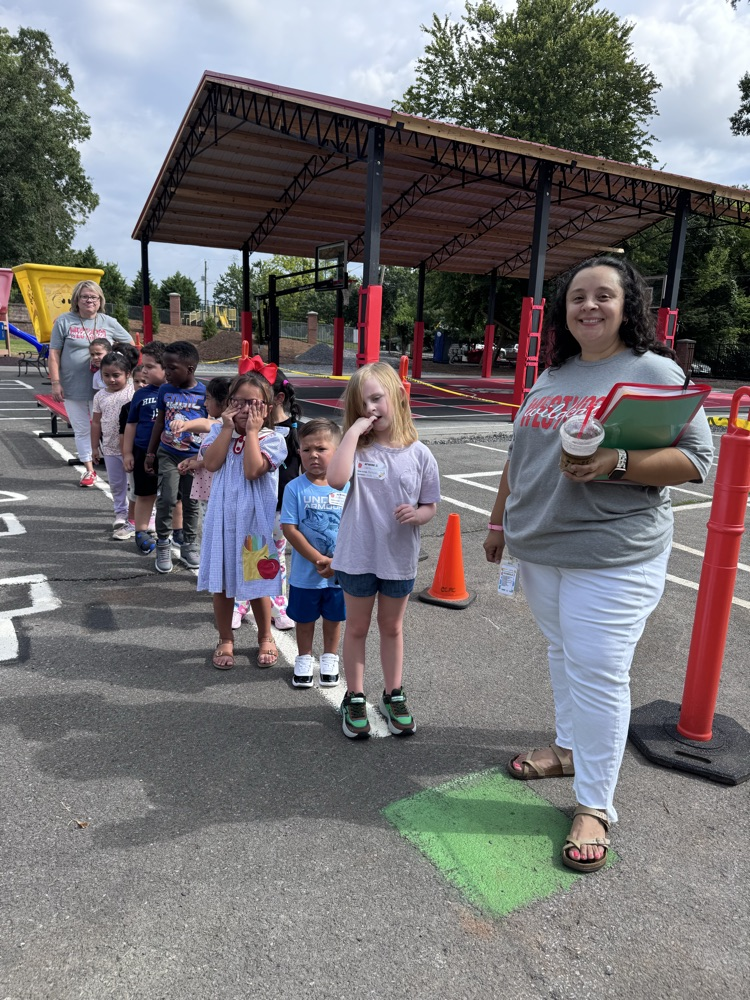 Mrs. Hurtado with her class at recess  