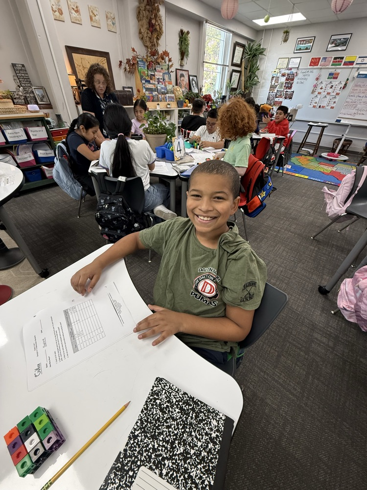 students in classroom working together 