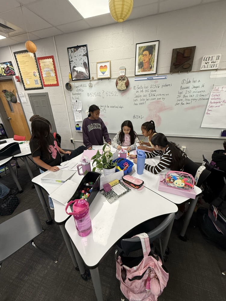students in classroom working together 