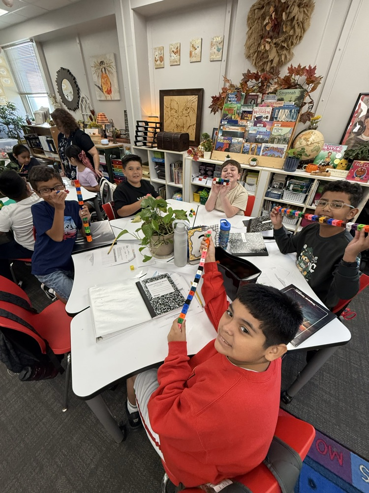 students in classroom working together 