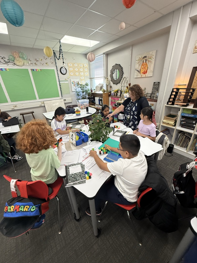 students in classroom working together 