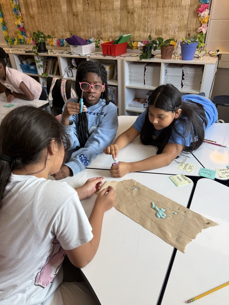 students in classroom working together 