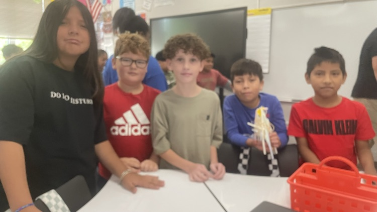 students completing the egg drop challenge together 