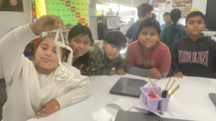 students completing the egg drop challenge together 