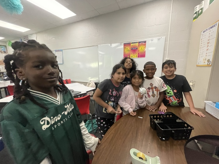 students completing the egg drop challenge together 