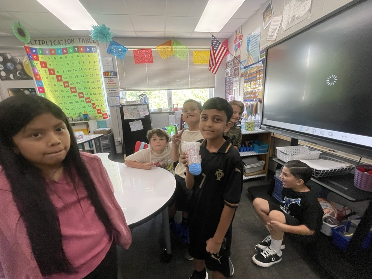 students completing the egg drop challenge together 