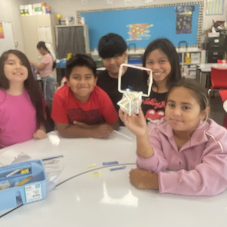 students completing the egg drop challenge together 