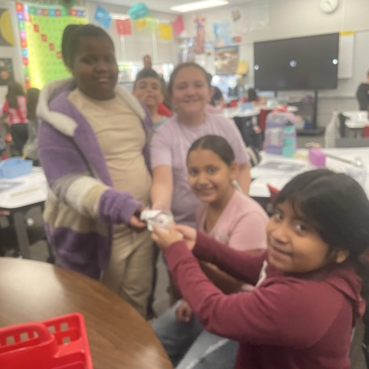 students completing the egg drop challenge together 