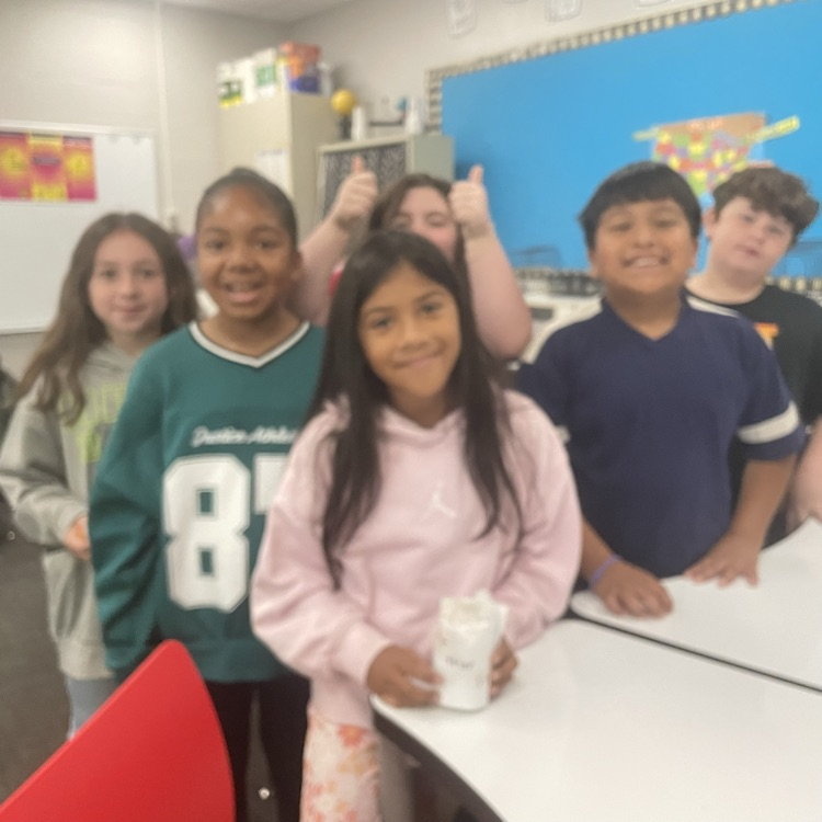 students completing the egg drop challenge together 