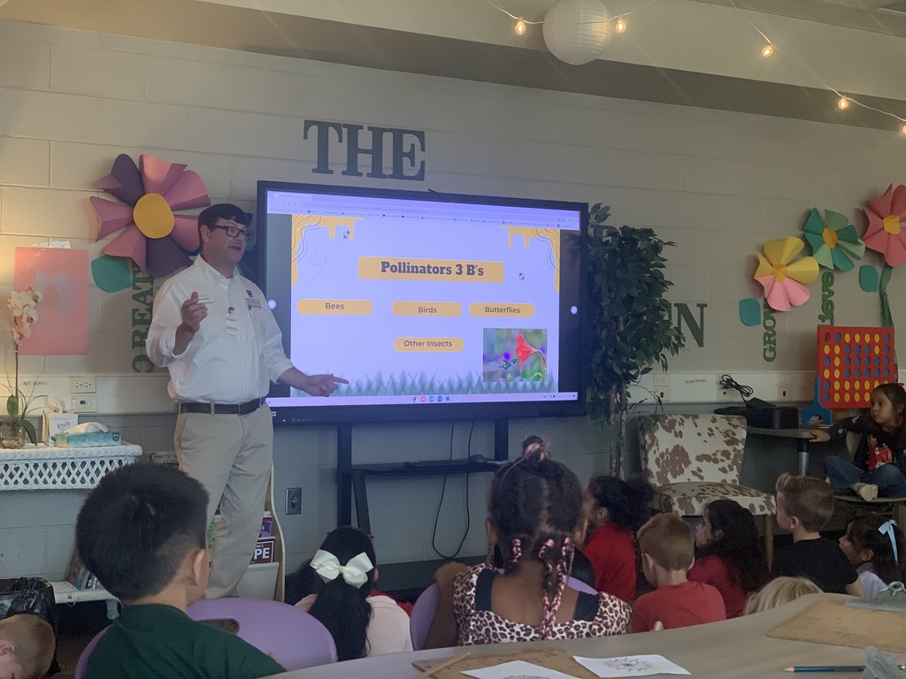 students learning about pollinators from the whitfield county 4H officers inside the brookwood media center