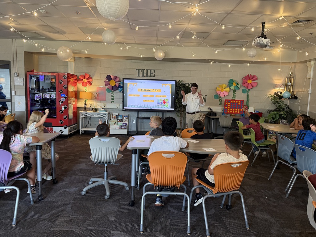 students learning about pollinators from the whitfield county 4H officers inside the brookwood media center