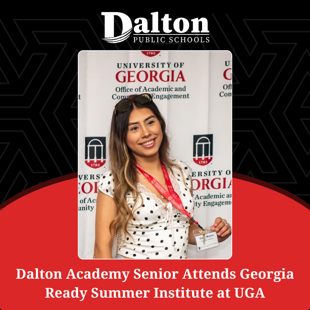 A square social media graphic framed by a black geometric pattern background, top Dalton Public Schools logo, and a curved red section at the bottom reading "Dalton Academy Senior Attends Georgia Ready Summer Institute at UGA" in bold white text. In the center is a portrait photo of a smiling young woman with highlighted hair, sunglasses on her head, and a polka-dot top holding her name badge attached to a red University of Georgia (UGA) Office of Academic and Community Engagement lanyard.