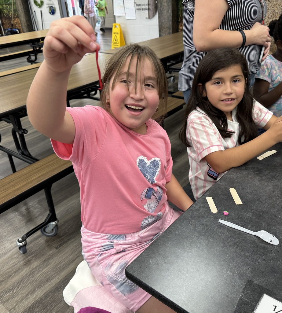 students using "trash" items to create toys