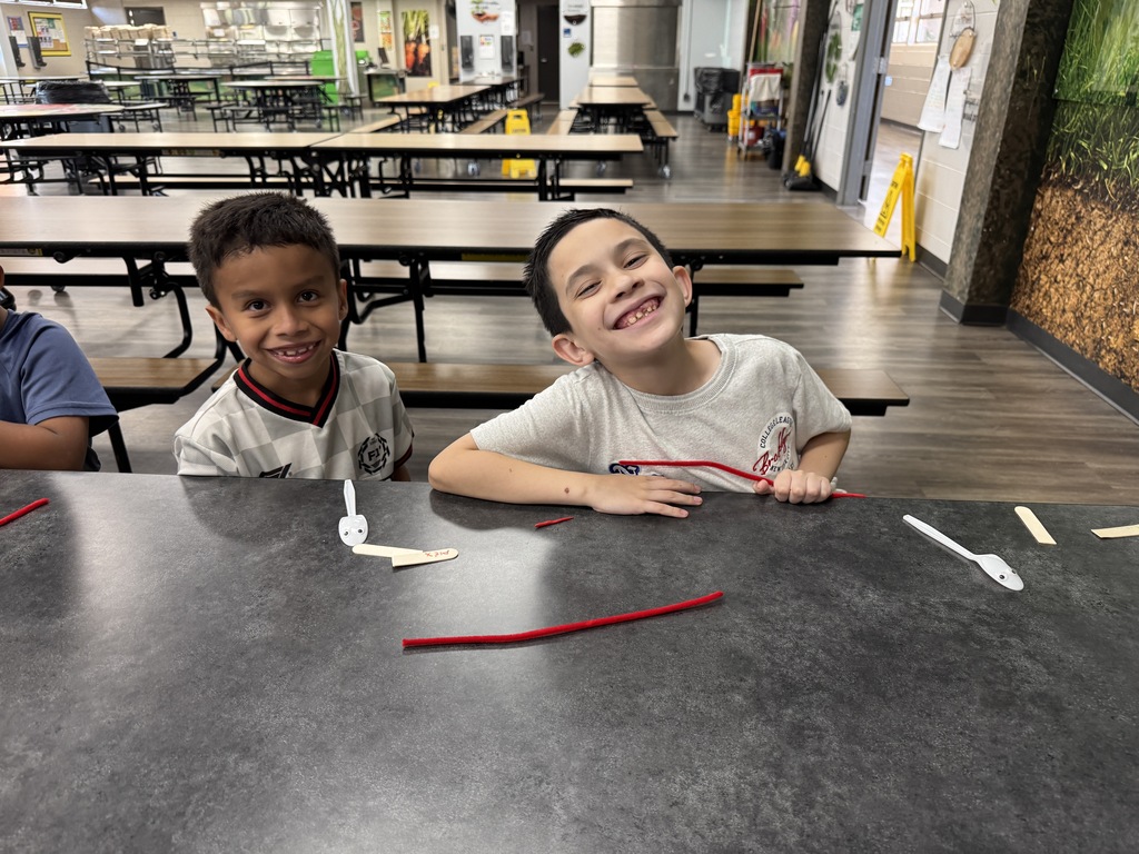 students using "trash" items to create toys